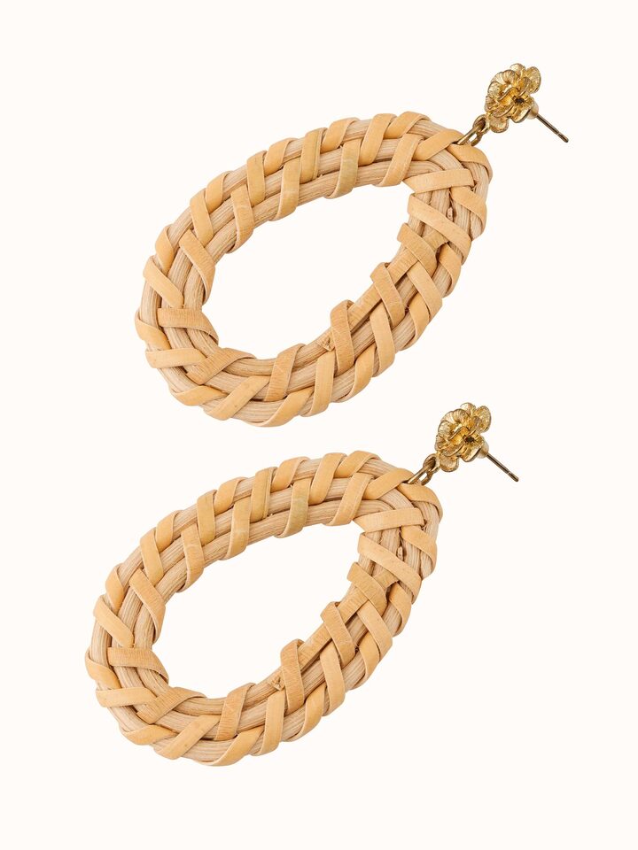 Angled view of handcrafted stud earrings focusing on intricate design and fine craftsmanship