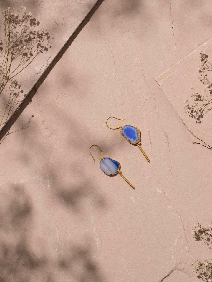 Angled view of Agate Drop Earrings showcasing the unique agate stone settings.