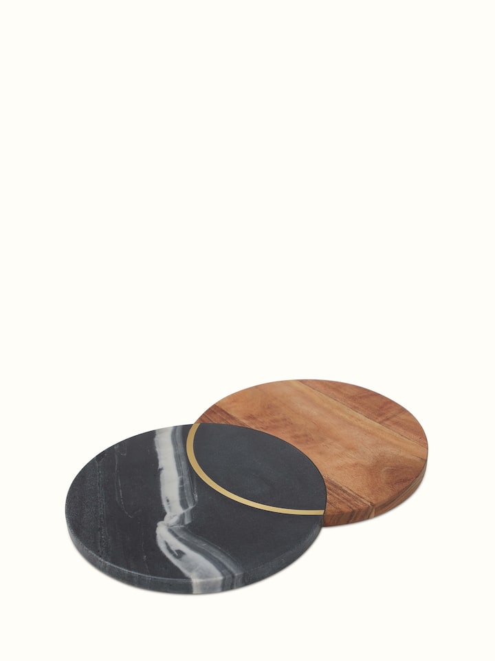 Detailed view of marble and acacia wood cheese board, focusing on the elegant marble surface and wooden handle.