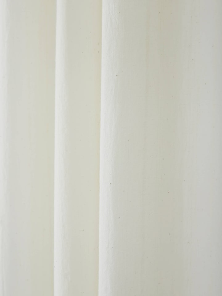 Detailed view of Kapasa Off-White Solid Handloom Cotton Curtain (7 ft) showing fabric weave and texture