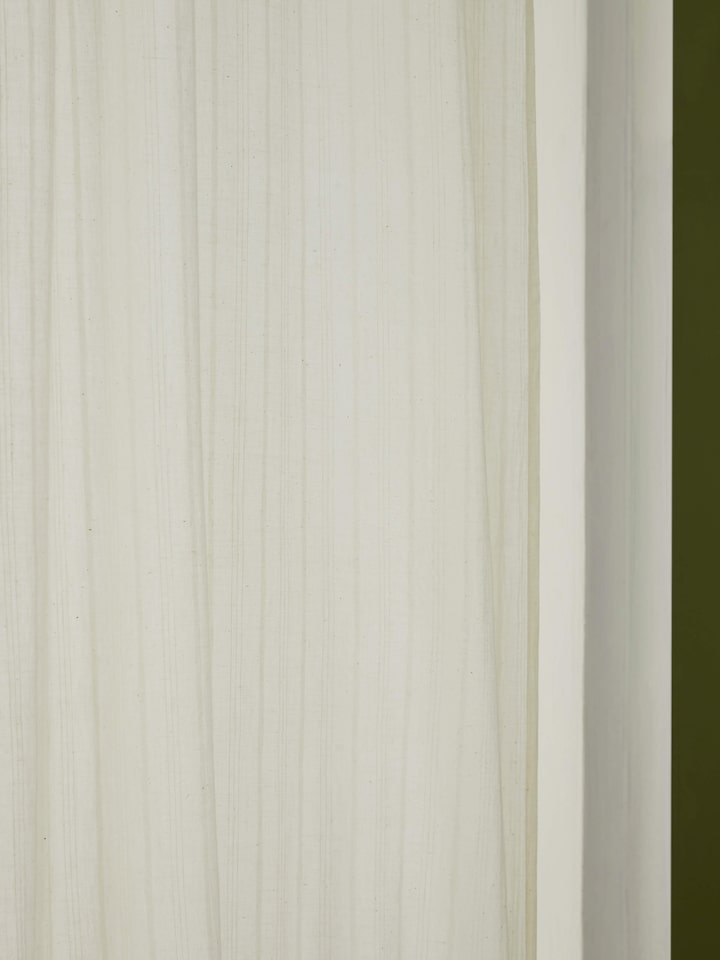 Full length view of Kapasa Off-White Solid Handloom Cotton Curtain (7 ft) in a room setting