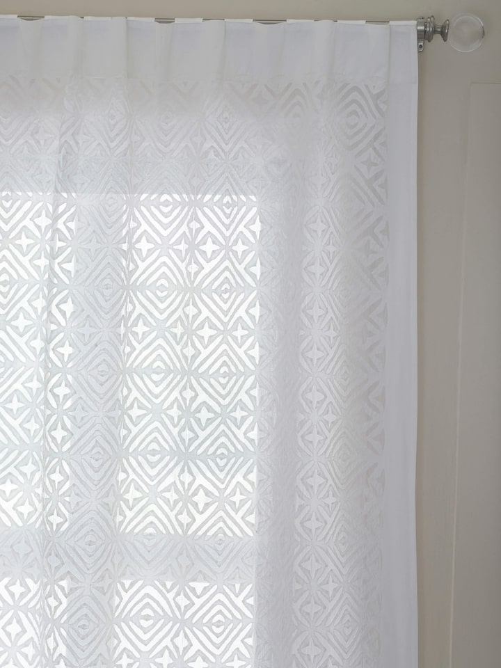 Detailed view of Mandana White Trellis cotton sheer curtain featuring the delicate trellis pattern