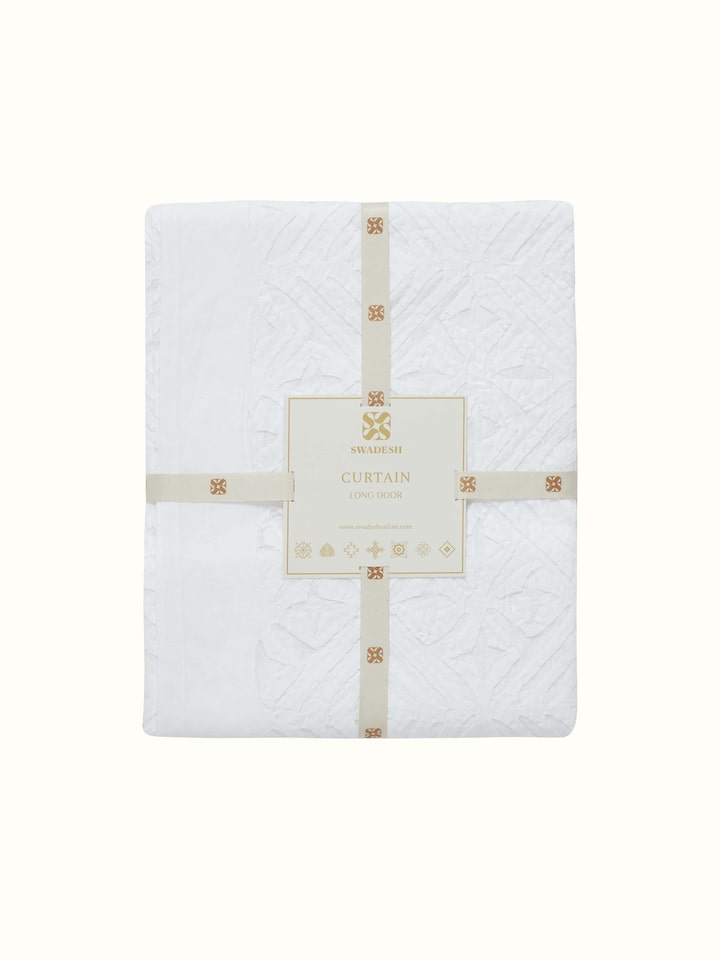 Side view of Mandana White Trellis cotton sheer curtain illustrating the full length and sheer fabric