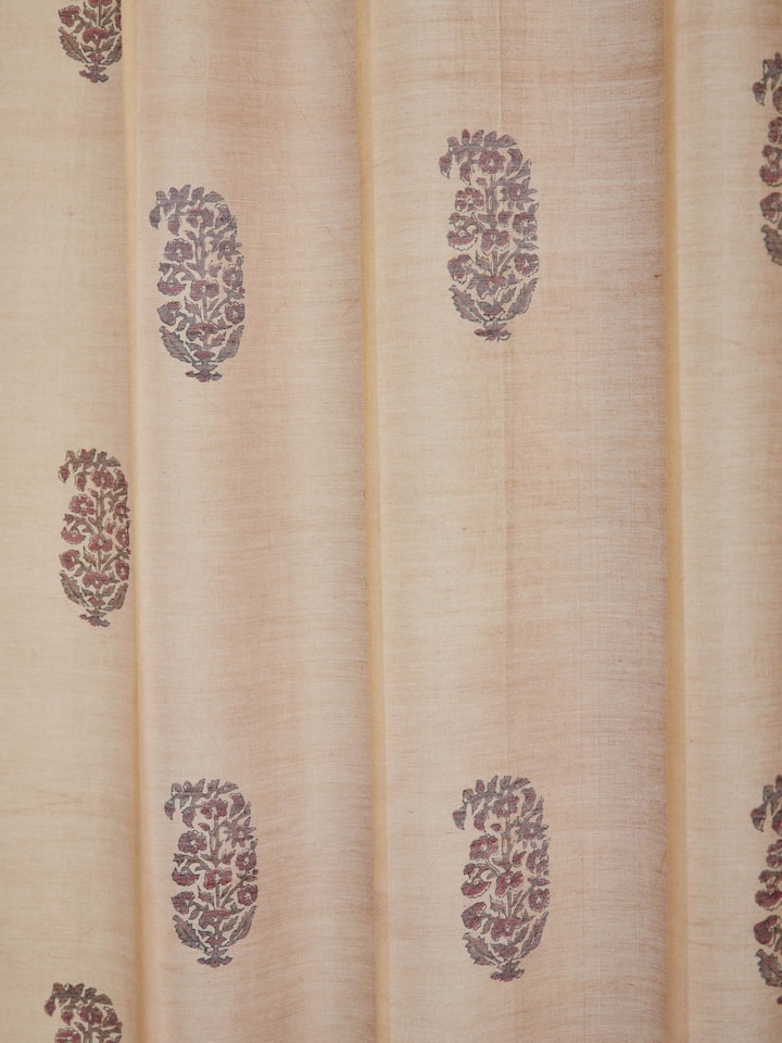 Perspective view of Vasudha rust buta silk cotton Bagru hand block print sheer curtain illustrating its drape and block print pattern.
