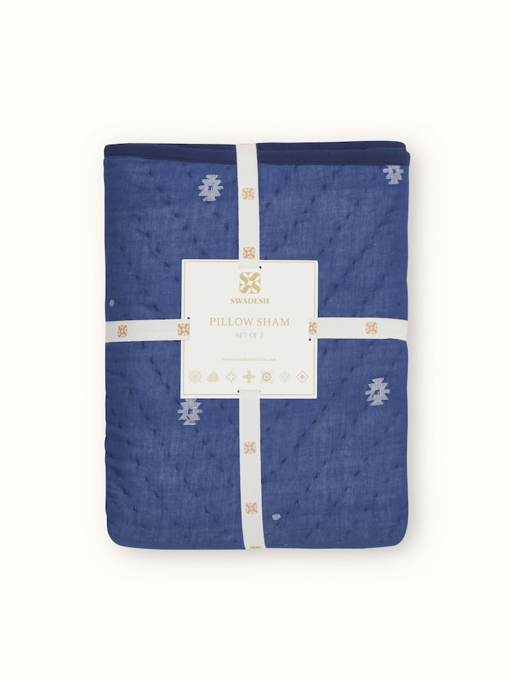 Close-up of Kalpanama indigo woven buti cotton pillow shams with detailed buti design and rich indigo tones.
