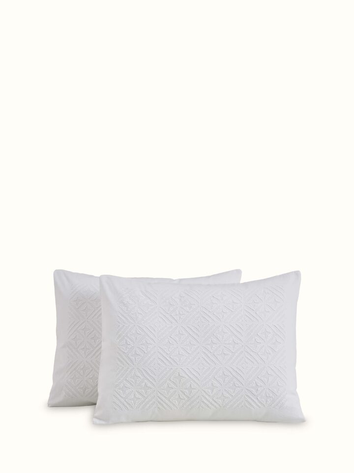 Top view of Jharokha White Trellis Cotton Appliqué King Bedspread Set showcasing its detailed appliqué work.