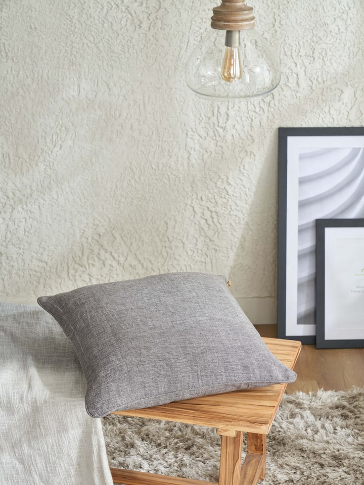 Close-up of Anek coffee mangal cotton Bhujodi handloom cushion cover, highlighting the detailed weave and texture.