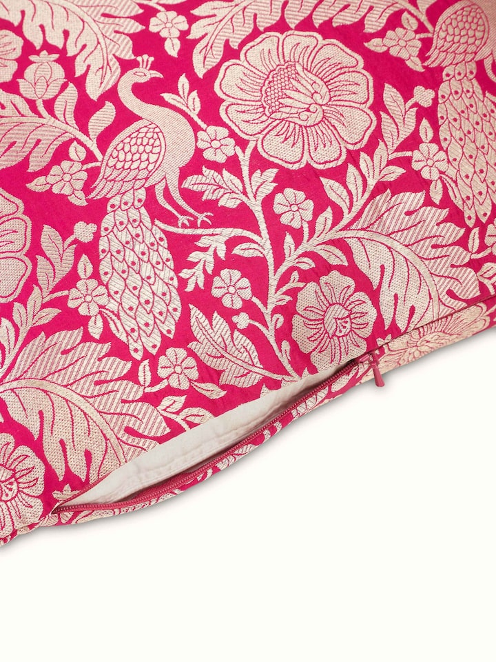 Detailed view of Avasa raspberry floral silk brocade Banarasi handloom cushion cover highlighting the craftsmanship and design elements.