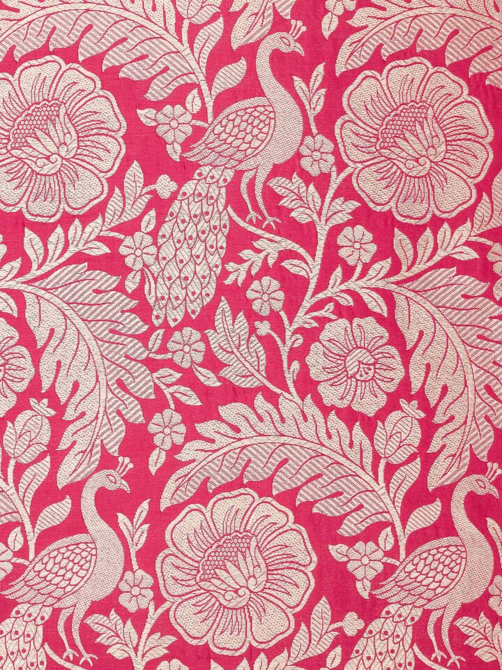 Perspective view of Avasa raspberry floral silk brocade Banarasi handloom cushion cover showcasing its elegant design and rich texture.