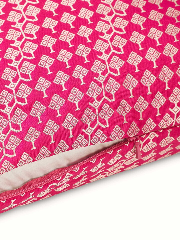 Close-up highlighting shimmering silk texture and traditional Banarasi weave on Avasa cushion