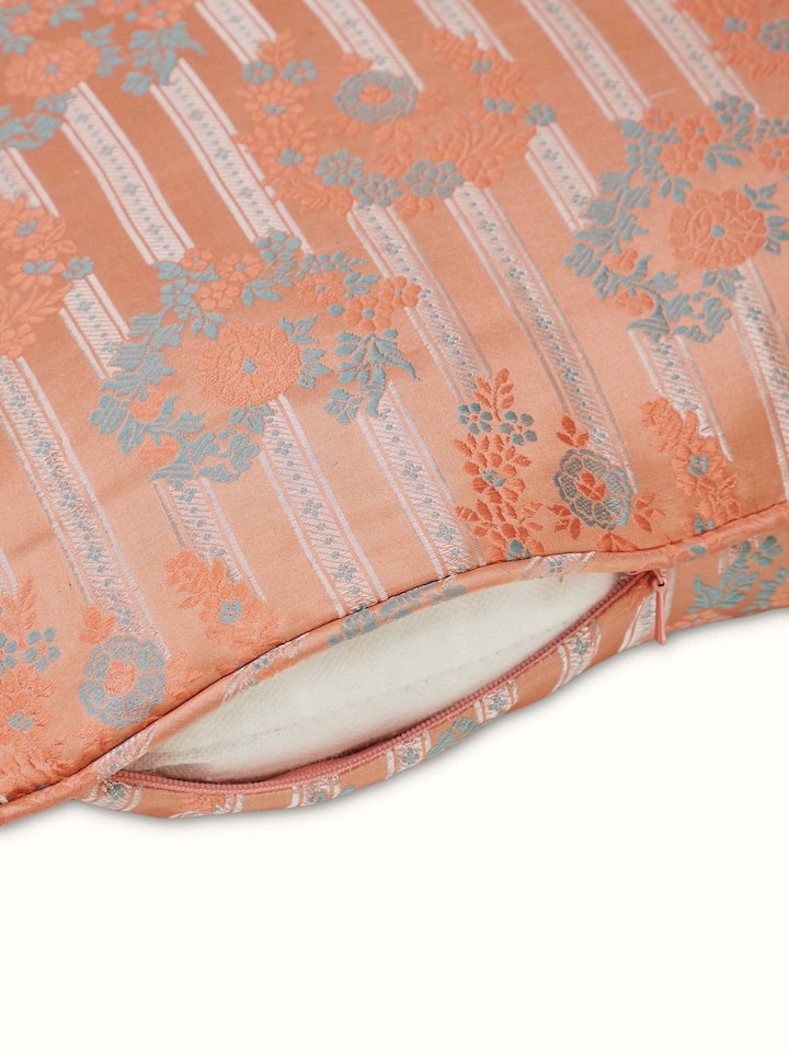 Close-up view of silk brocade cushion cover showcasing fine handloom detailing