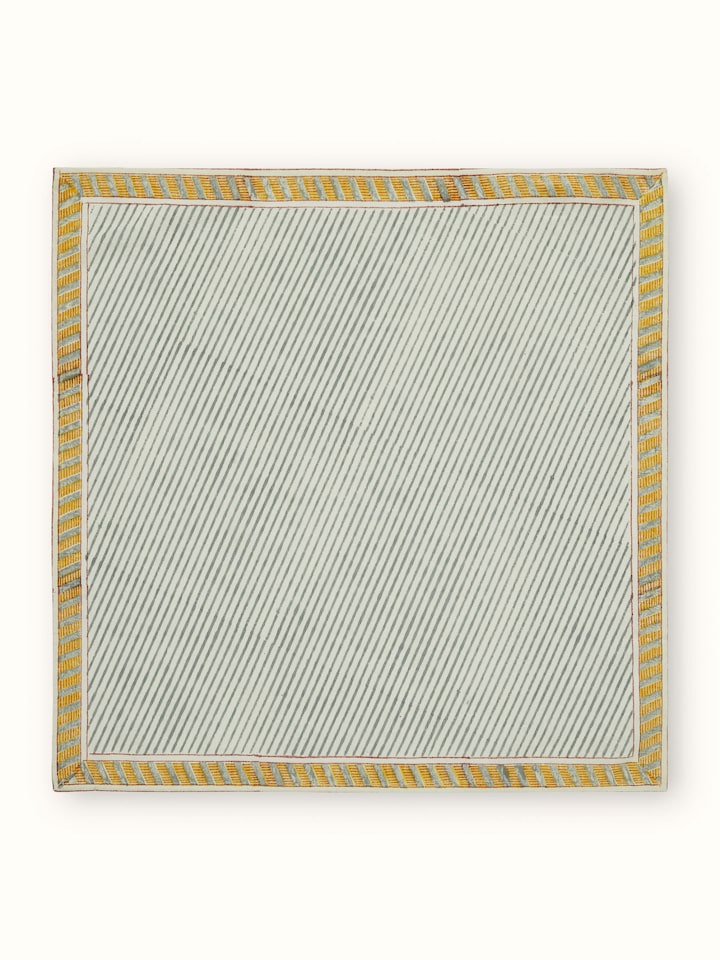 Close-up of Samaha twill grey stripe cotton Sanganeri block printed dinner napkins highlighting the block print details and stripe pattern.