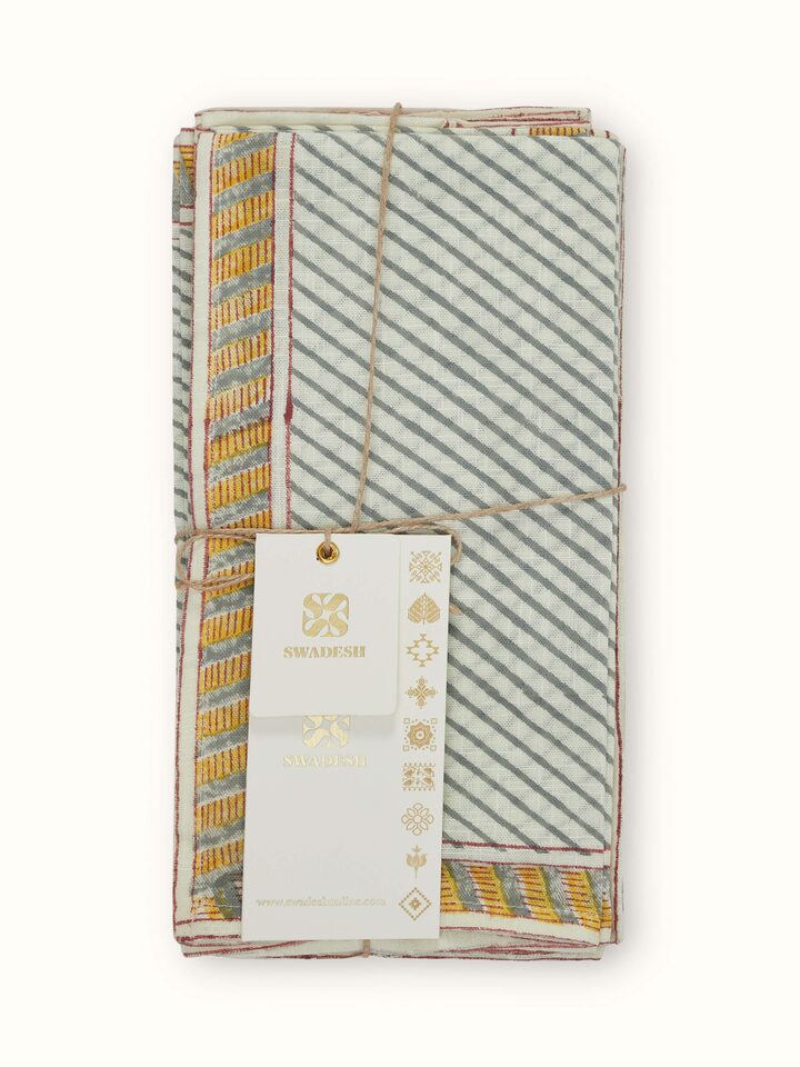 Detailed close-up of Samaha twill grey stripe cotton Sanganeri block printed dinner napkins focusing on the block print and grey stripes.