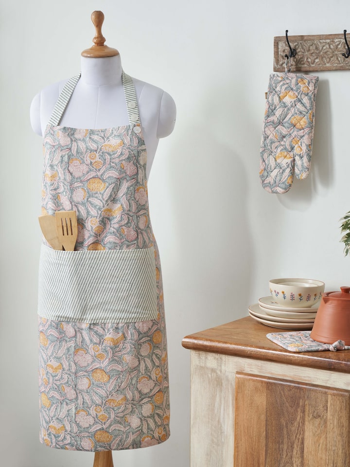 Side view of grey floral cotton Sanganeri block printed apron highlighting the apron’s design and block print details.