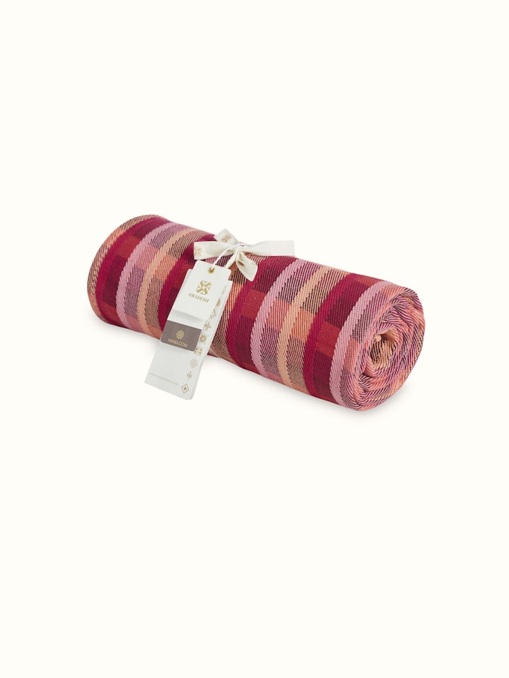 Close-up of Niketa Raspberry Plaid Cotton Throw, highlighting the intricate plaid design and rich handloom texture.