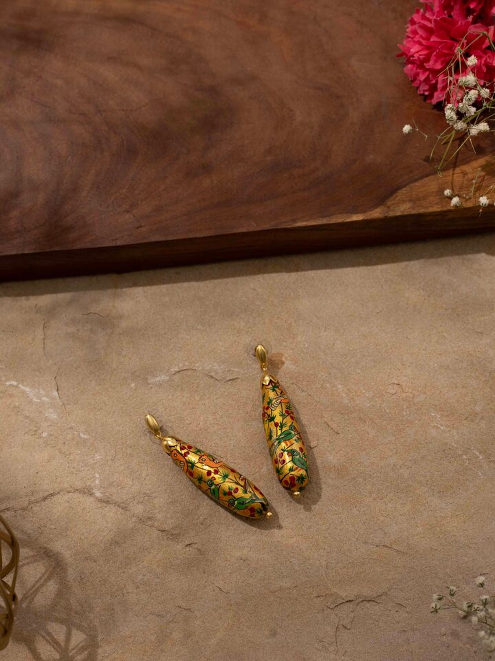 Close-up view of Papier-mâché Drop Earrings highlighting their intricate details.