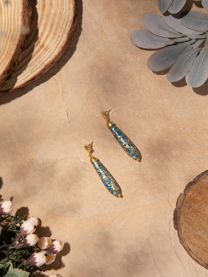 Angled view of Papier-Mâché Drop Earrings highlighting the unique artistic elements.