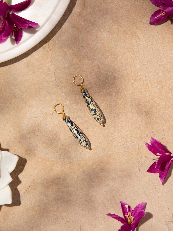 Side view of Papier-Mâché Drop Earrings showcasing their drop design and detailed artistry.