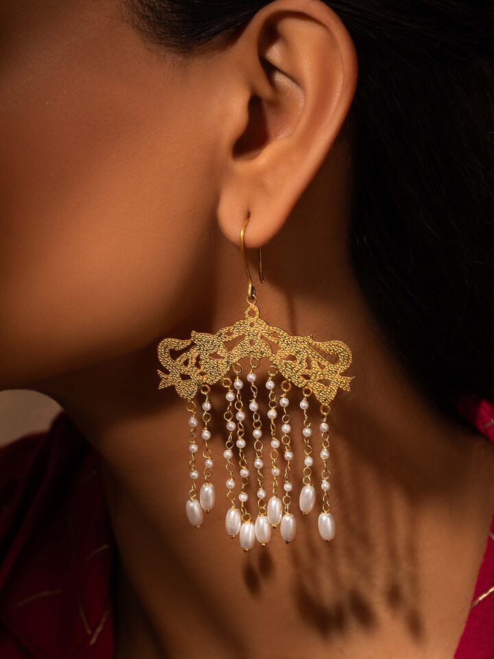 Side view of Silver Smithing Drop Earrings highlighting their detailed silverwork and elegant drop design.