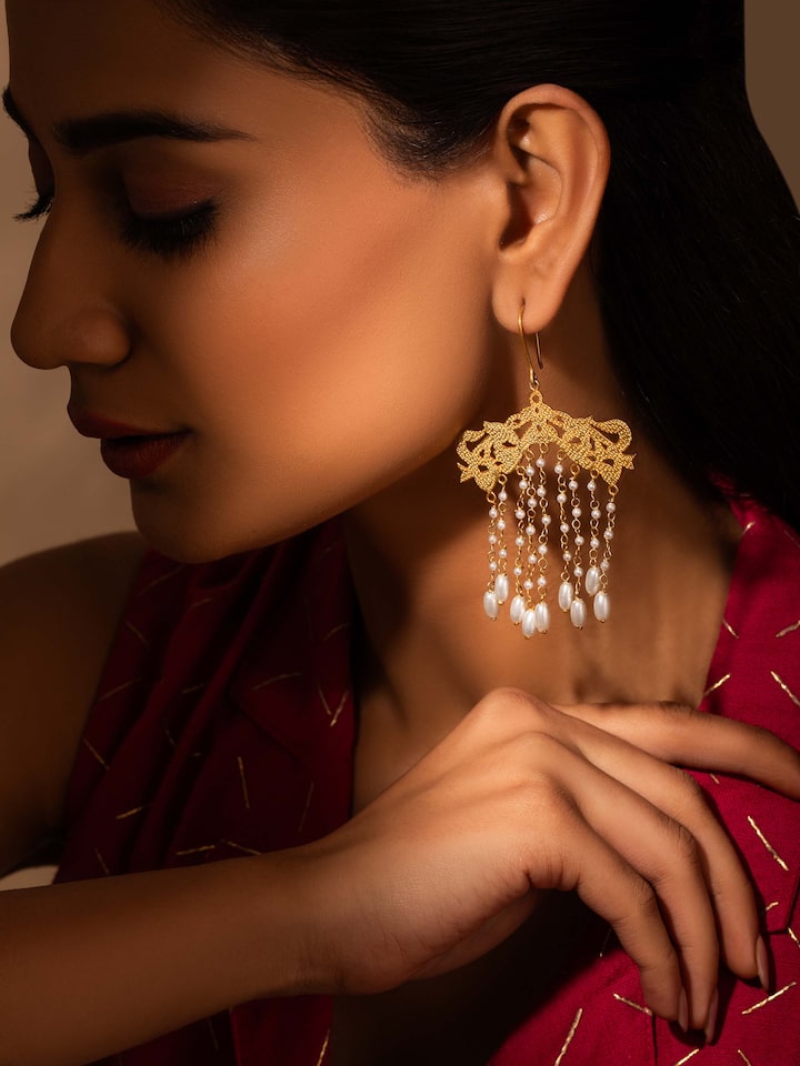 Close-up view of Silver Smithing Drop Earrings emphasizing the fine silver craftsmanship and design details.