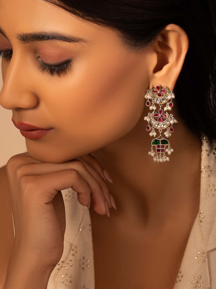 Close-up view of Silver Smithing Drop Earrings highlighting detailed silver craftsmanship.