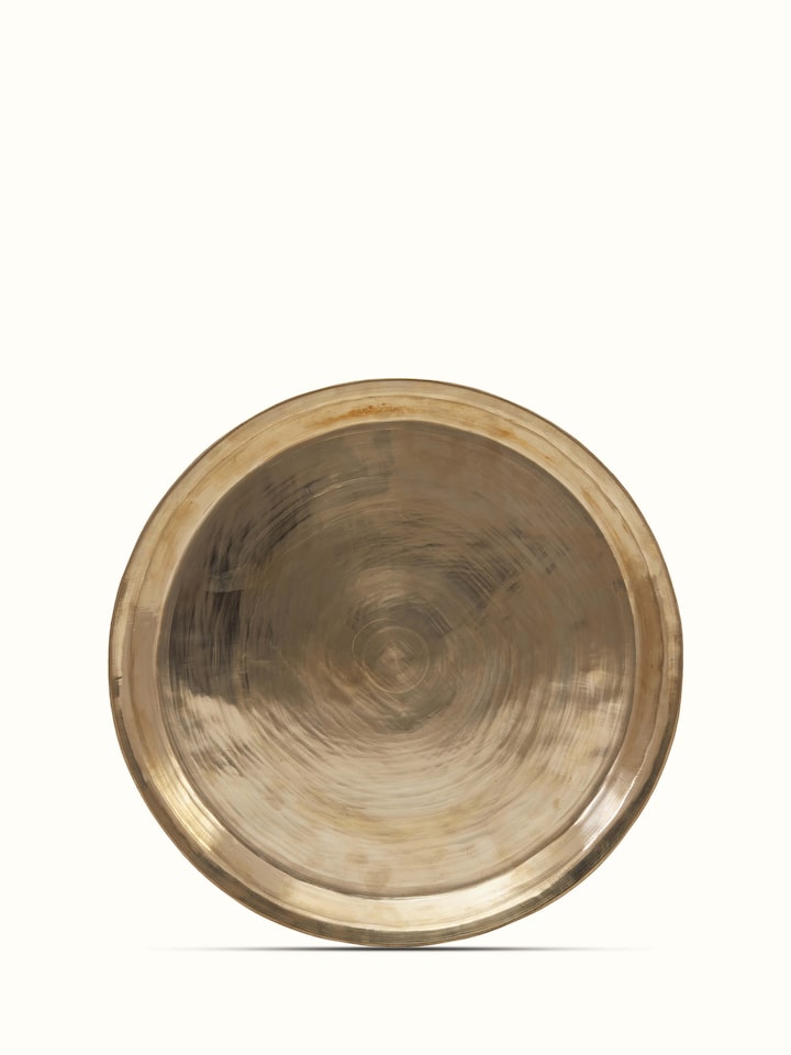 Top view of bell metal Balisiri dinner plate displaying elegant craftsmanship and traditional patterns