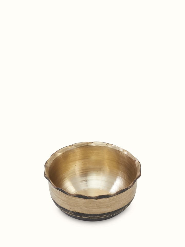 Side view of Bell metal pinchha dinner bowl showing its traditional design