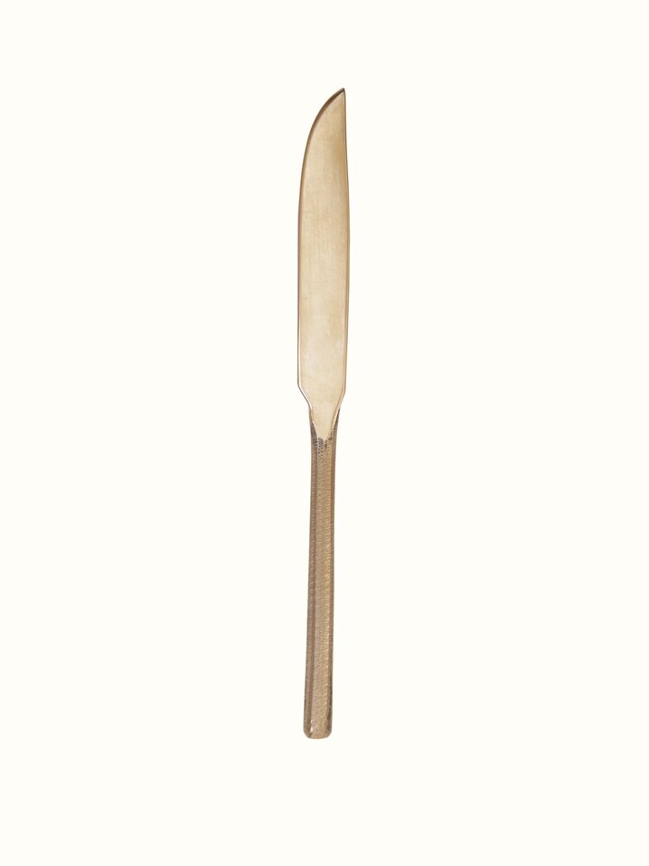 Side view of bell metal dinner knife showcasing intricate patterns