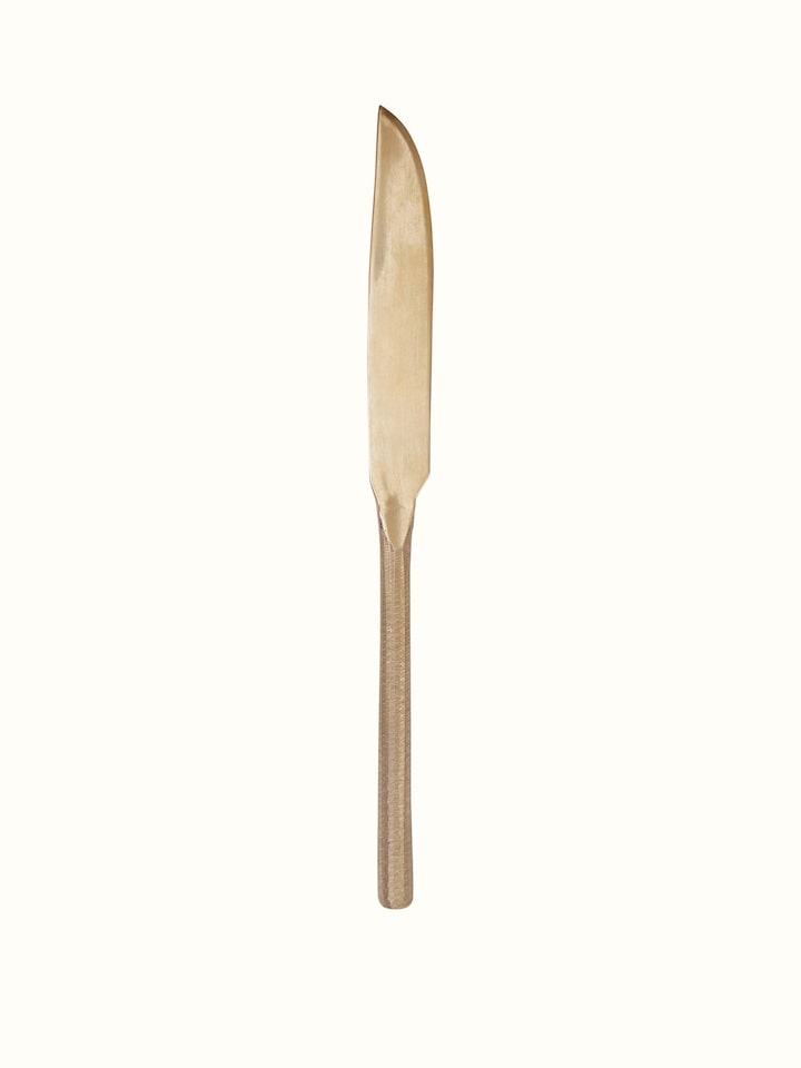 Close-up of bell metal dinner knife with decorative elements