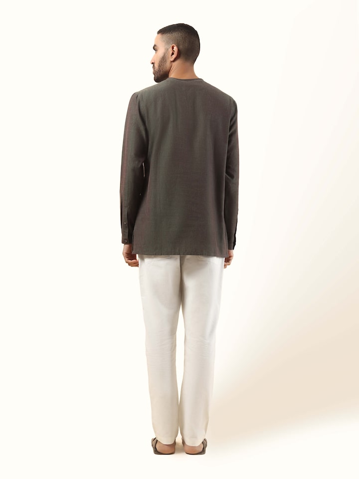 Back view of brown short kurta made with extra-weft cotton, showing neat finish and yoke.