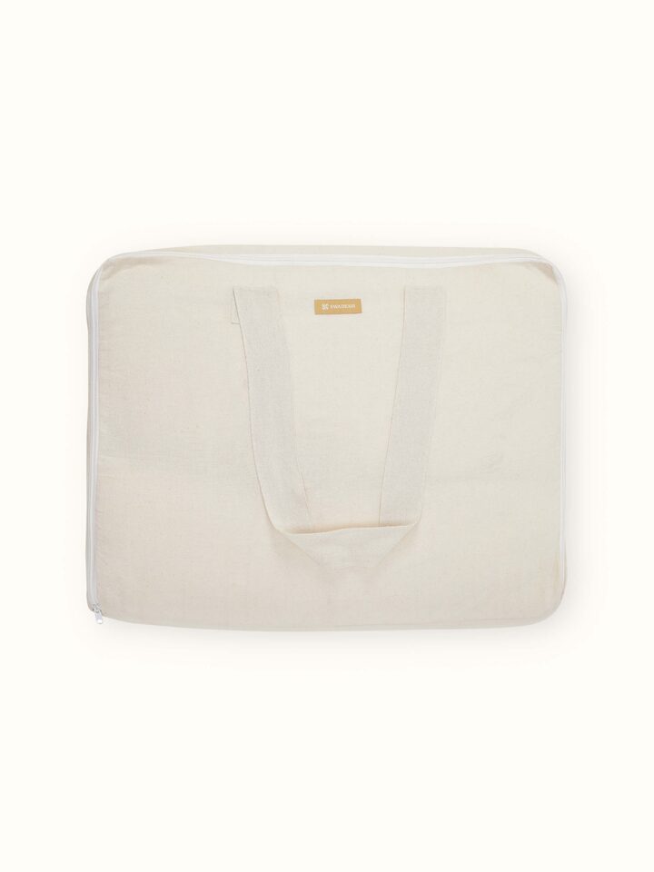 Kapasa off-white cotton handloom bedspread set folded neatly, highlighting its texture and color