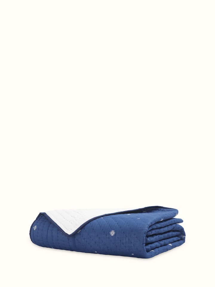 Detailed view of Kalpanama Indigo Woven Buti Cotton Single Quilt, highlighting the woven buti pattern and texture.