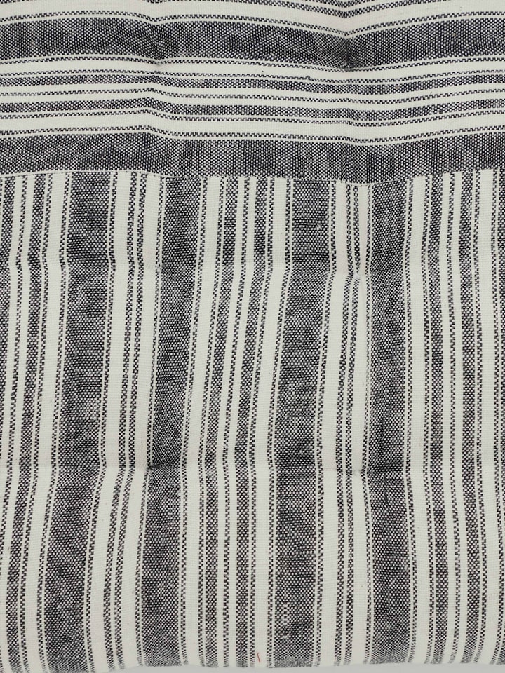 Detailed side view highlighting cushion tufting and black cotton texture – Krsna seating pad