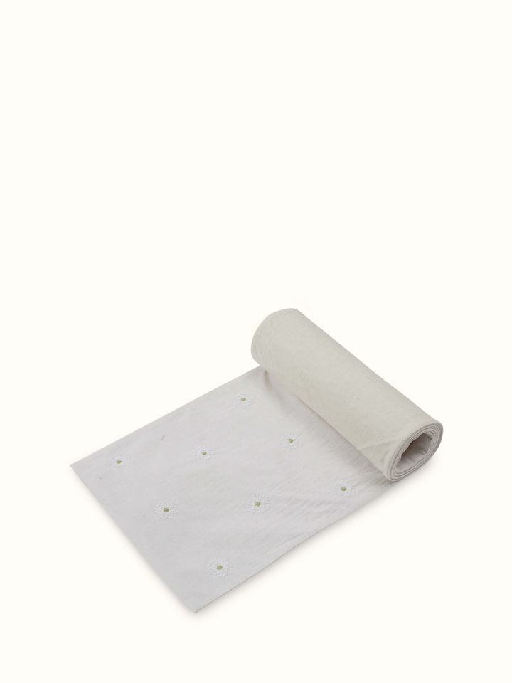 Angled view of table runner showing full length and elegant fall.