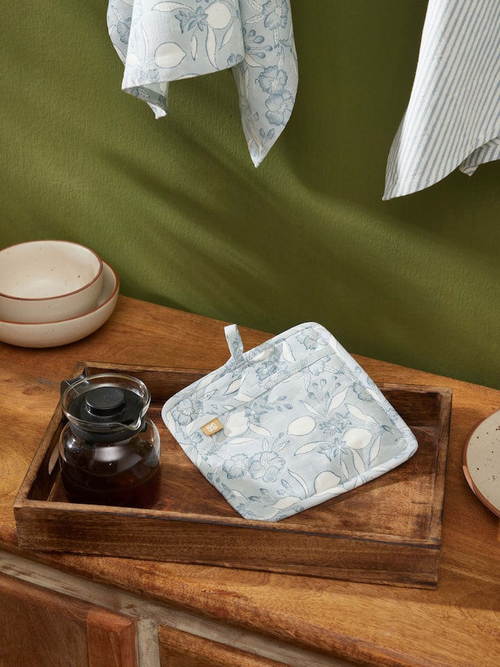 Close-up of Anika light blue floral cotton Sanganeri block printed pot holder showcasing the block print details and floral design.