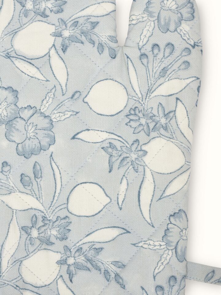 Angled view of Anika Light Blue Floral Cotton Sanganeri Block Printed Oven Mitts showing overall pattern