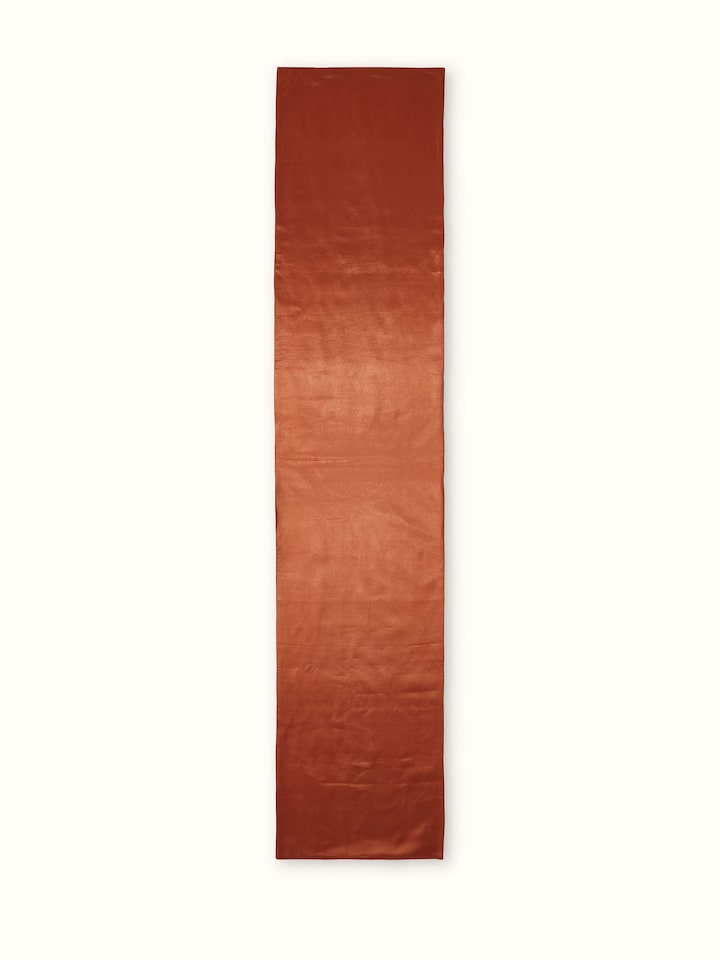Overhead view showcasing full length of runner and linear Ikat stripe layout.