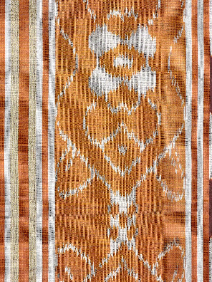 Close-up view of Sanchaya rust allover stripe silk Odisha ikat handloom cushion cover, emphasizing the detailed stripes and fabric.