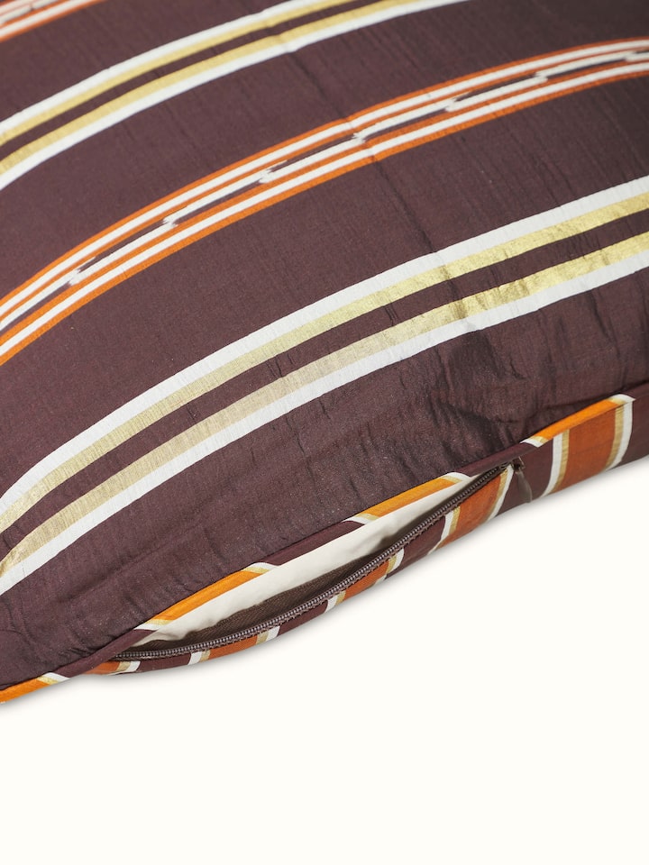 Detailed shot of Sanchaya Coffee Stripe Silk Odisha Handloom Ikat Cushion Cover showcasing the handloom details and color.