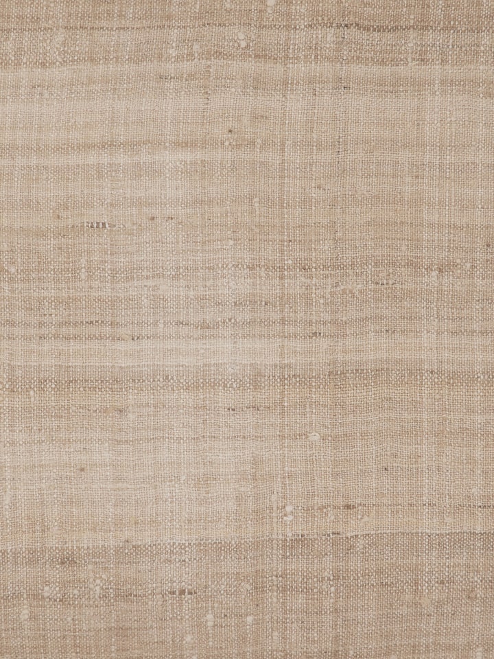 Close-up view of Ujjal light brown dharana silk slub handloom cushion cover showcasing the texture and stitching details