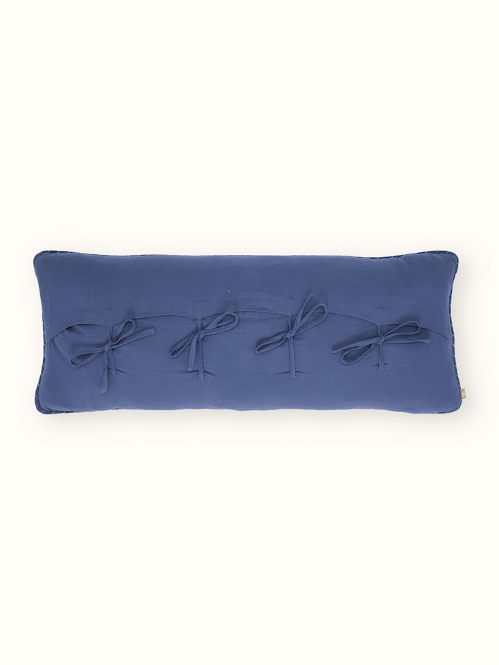 Back view showing button closure and plain cotton backing on Rann cushion cover.