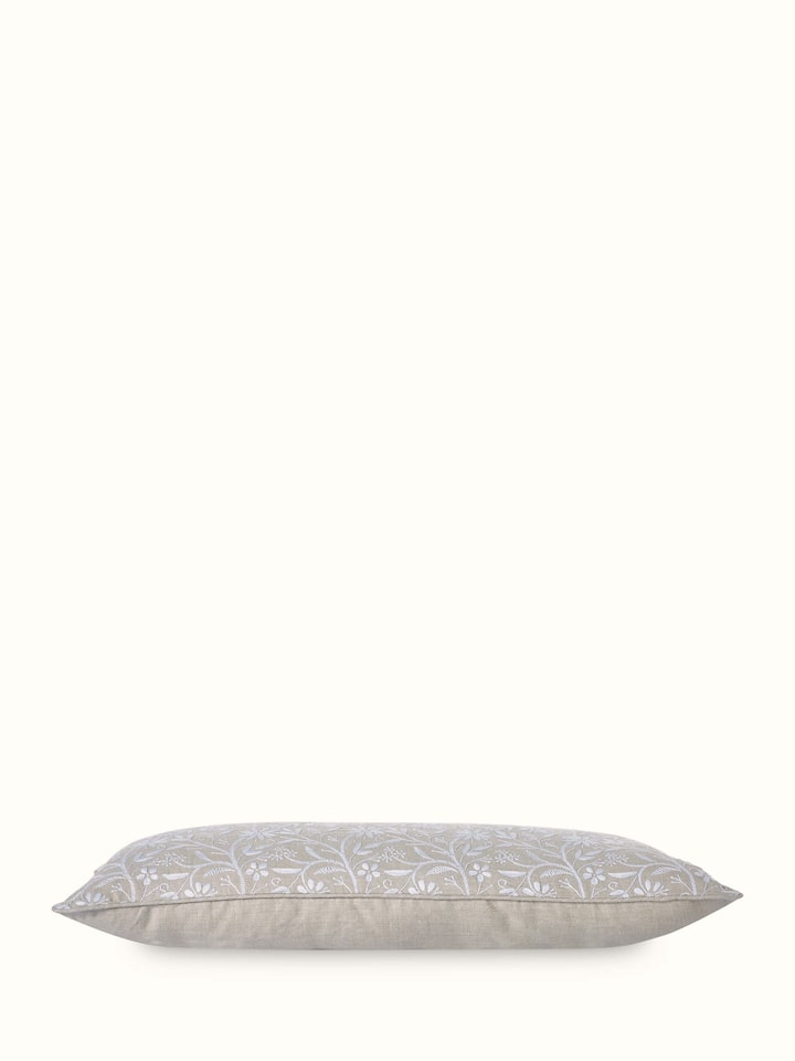 Detailed view of Rann beige allover cotton Chikankari hand embroidered cushion cover highlighting the craftsmanship of the Chikankari work.