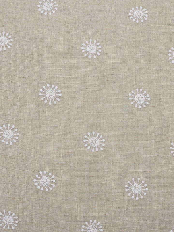 Detail shot of embroidery and texture on beige cotton cushion – Rann hand-embroidered piece