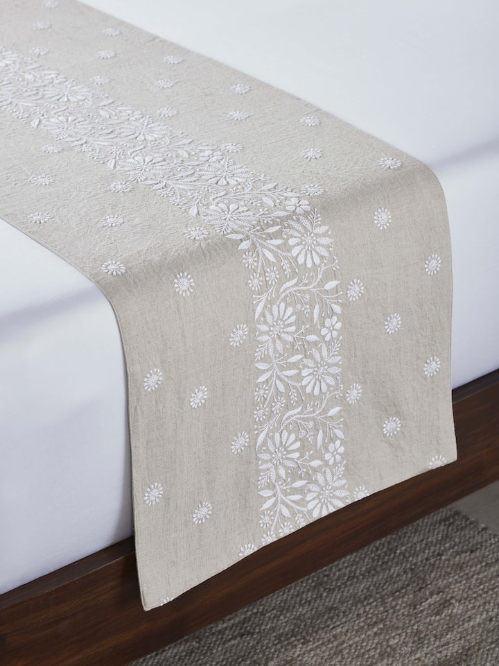 Top view highlighting intricate floral chikankari embroidery and border detailing.