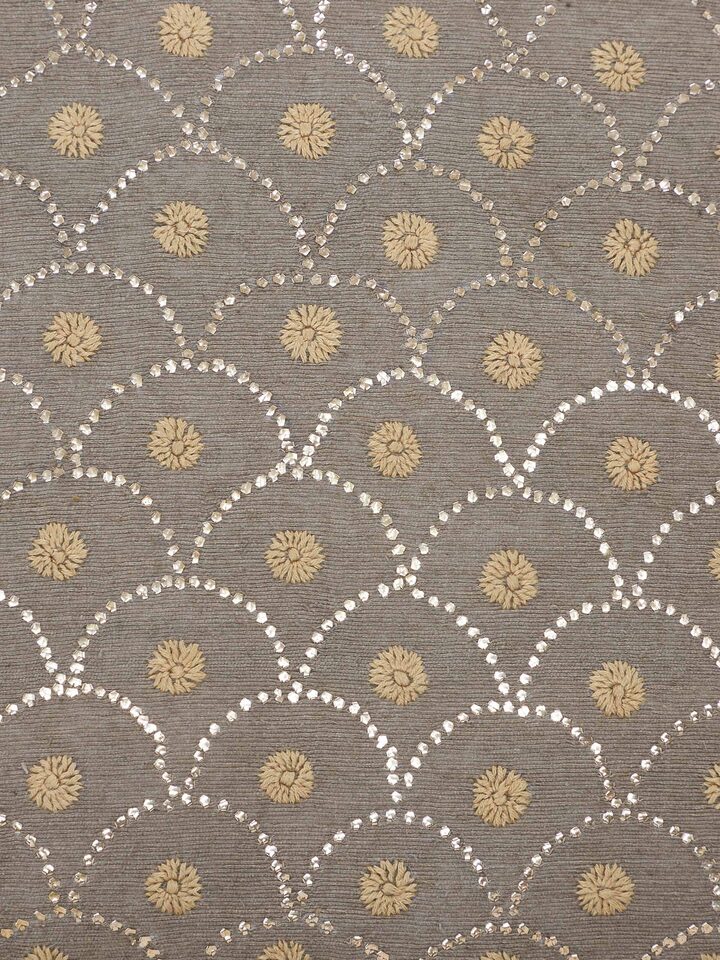 Close-up detail capturing hand embroidery and texture on Pragya silk cushion cover