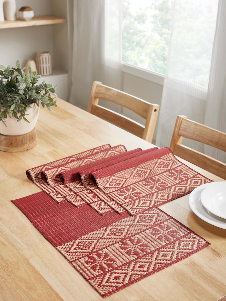 Styled view of Prakriti Red Folk Geo Natural Fibre Madurkathi Table Mats (6 Pcs) styled on a table or bed setting