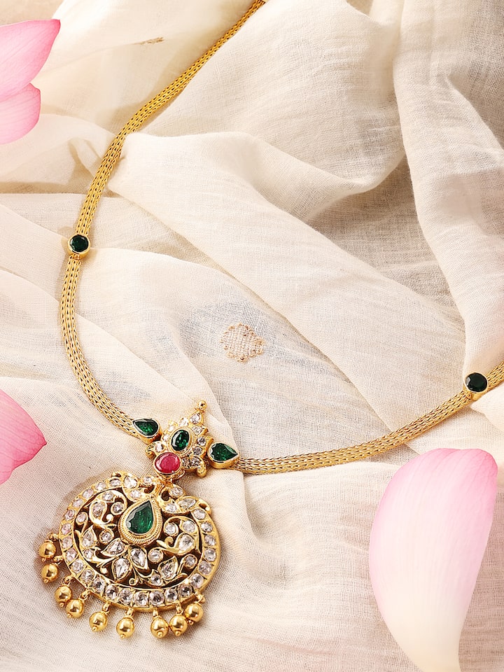 Close-up side angle highlighting the detailed craftsmanship of the gold collar necklace