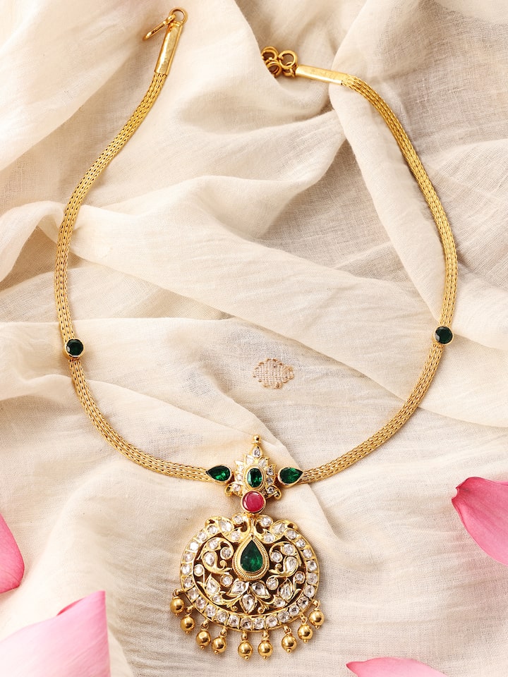 Angled view emphasizing the smooth curves and fine finish of the necklace