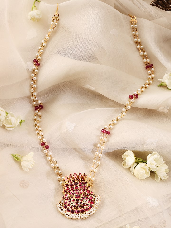 Angled view of Kundala Velai 22 Karat Gold Collar Necklace emphasizing the detailed goldwork.