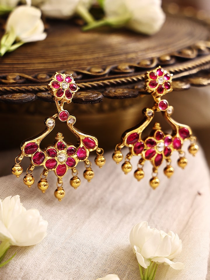 Close-up view of Kundala Velai 22 Karat Gold Jhumkas highlighting detailed craftsmanship and gold finish.